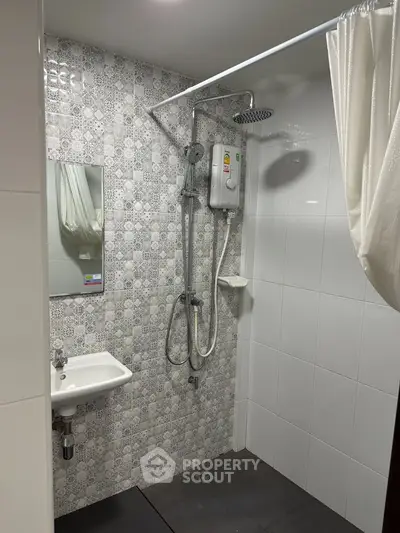 Modern bathroom with stylish shower and patterned tiles
