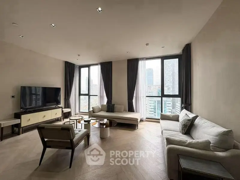 Spacious modern living room with large windows and city view, featuring elegant furniture and stylish decor.