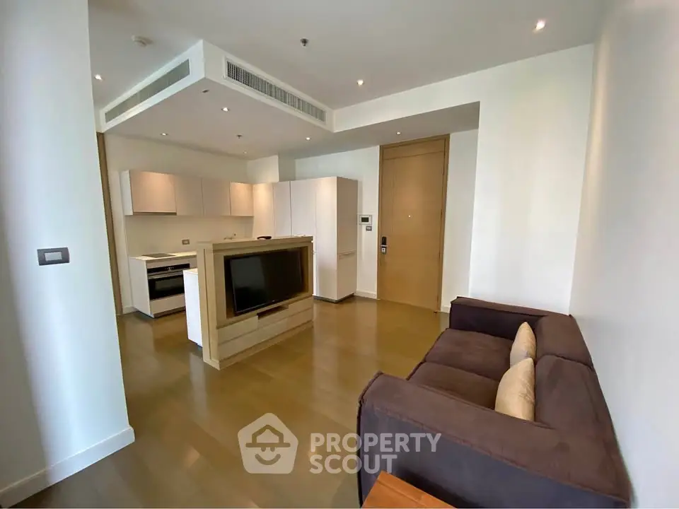 Modern open-plan living room with kitchen and stylish furniture