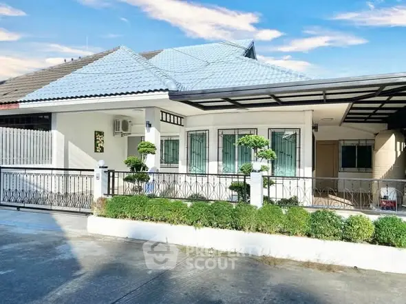 Charming single-story house with manicured garden and modern design.