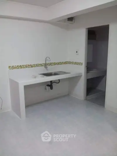 Minimalist kitchen with open layout and modern sink design