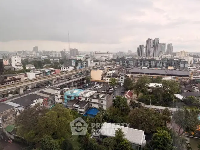 Panoramic cityscape view showcasing urban residential and commercial buildings.
