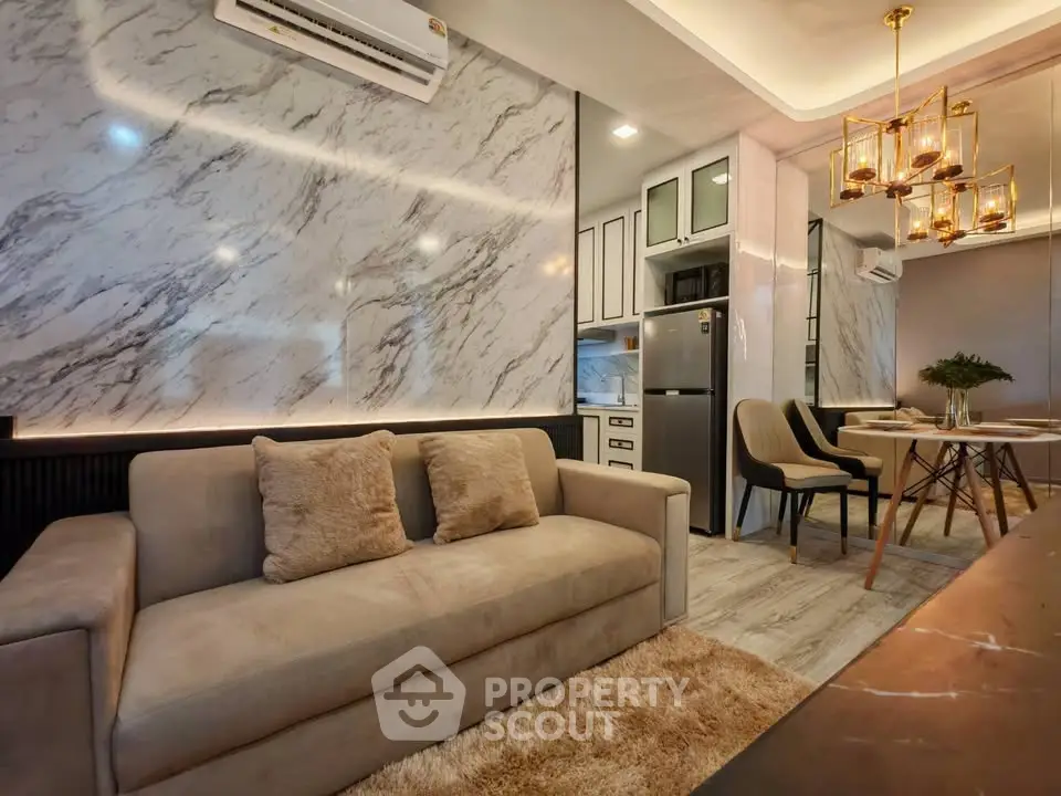 Luxurious modern living room with marble accents and elegant dining area.