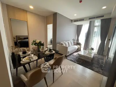 Modern living room with elegant dining area and cozy seating, featuring stylish decor and natural light.