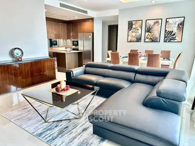 Luxurious modern living room with sleek leather sofa and elegant dining area