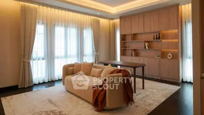 Elegant living room with modern sofa, stylish shelving, and ambient lighting.