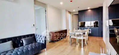 Modern living room with elegant dining area and sleek kitchen design