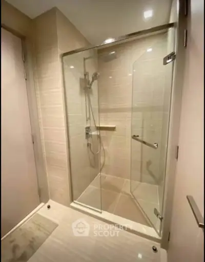 Modern bathroom with glass shower enclosure and sleek design