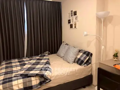 Cozy bedroom with stylish decor and comfortable bedding, perfect for relaxation.