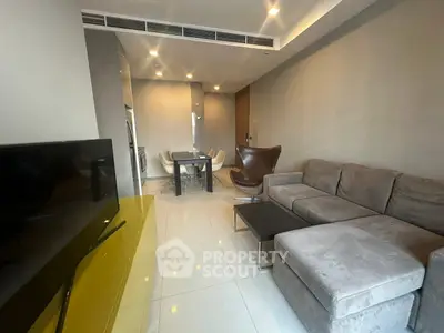Modern living room with sleek furniture and open layout, perfect for urban living.