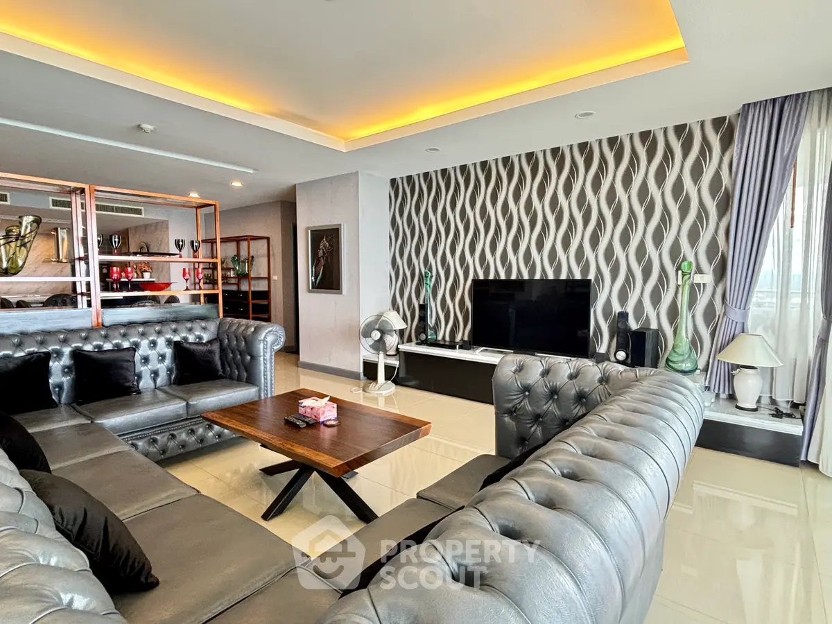 Luxurious living room with modern decor and stylish furniture in a high-end apartment.