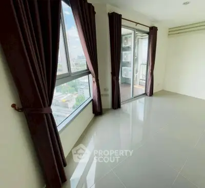 Spacious corner unit with large windows and city view, perfect for natural light lovers.