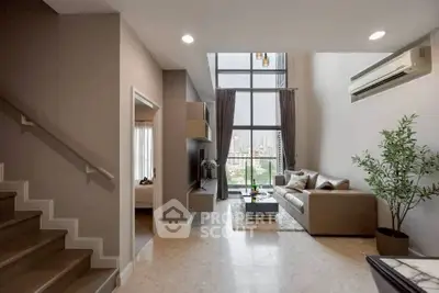 Modern living room with high ceiling and city view, featuring elegant decor and natural light.