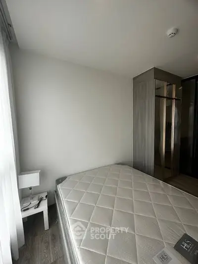 Modern bedroom with sleek design and ample natural light