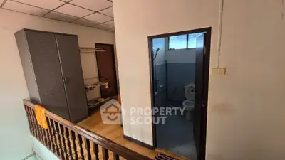 Compact bathroom with adjacent storage area in a residential property