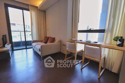 Modern living room with balcony view and stylish furniture