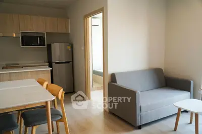 Modern apartment interior with cozy living room and kitchen area