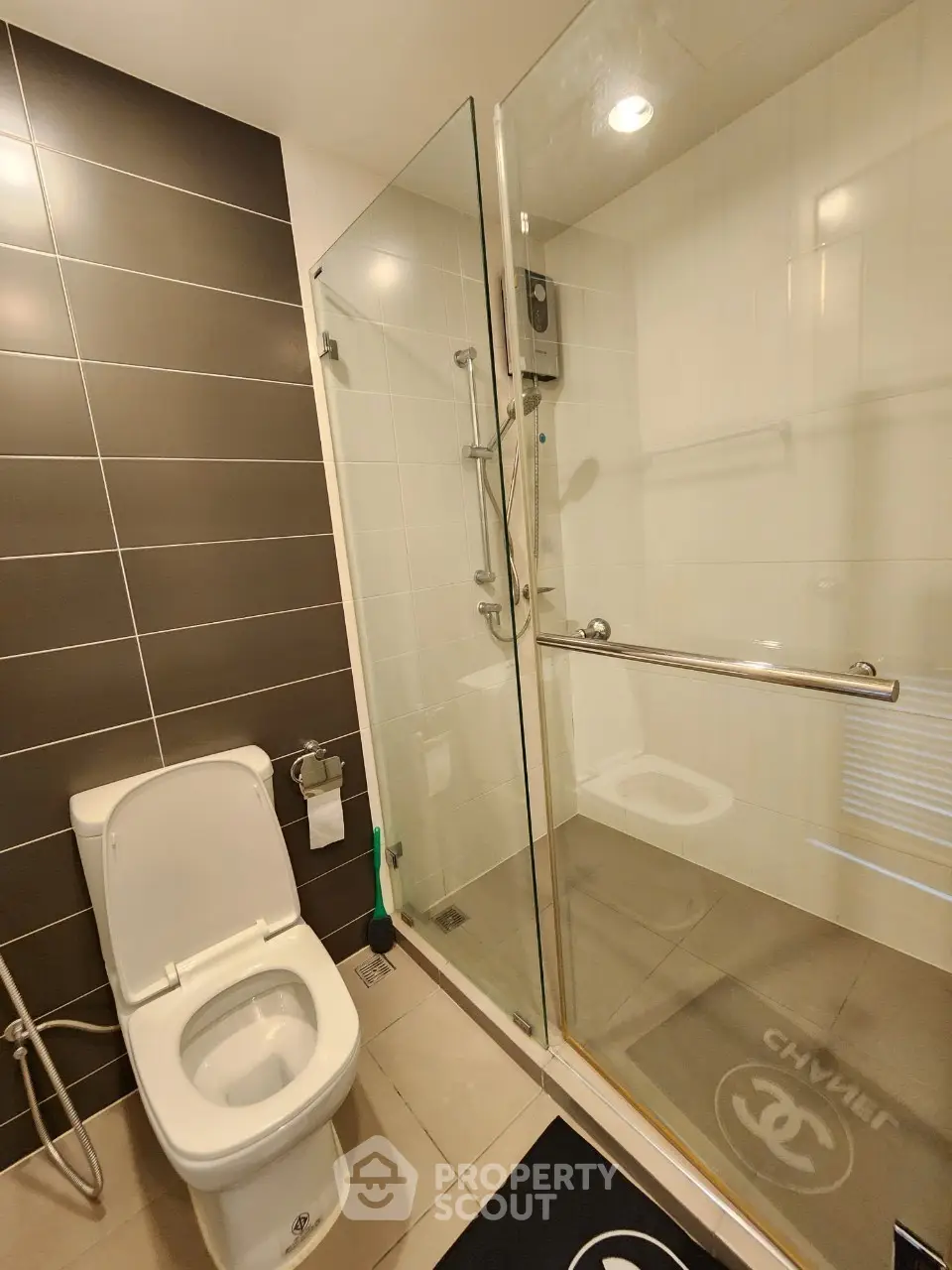Modern bathroom with glass shower and sleek tile design