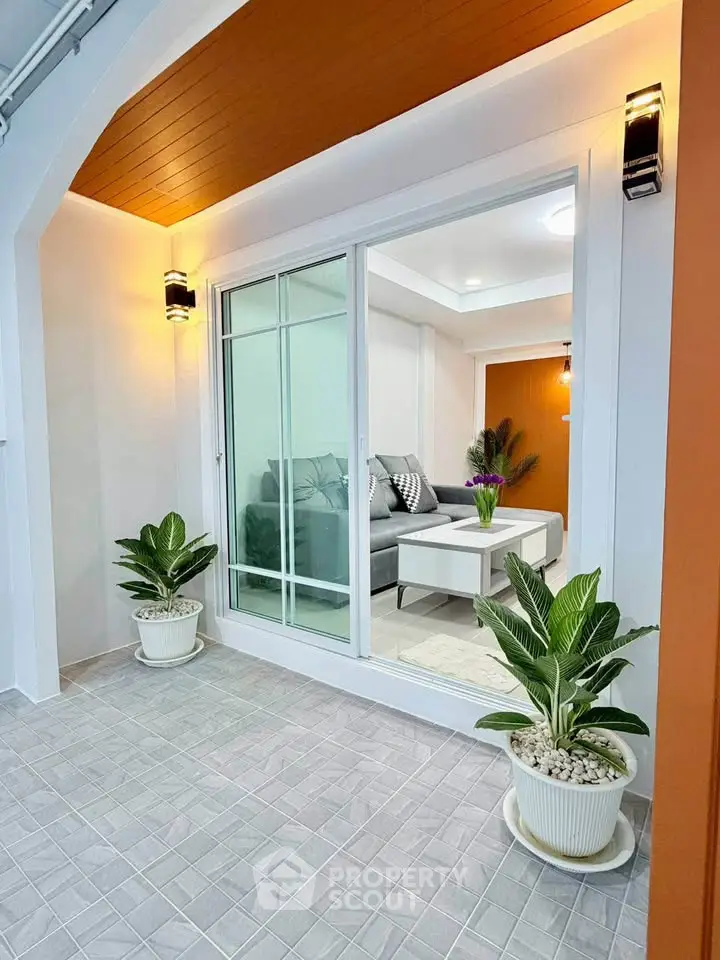 Modern living room with glass sliding doors and stylish decor