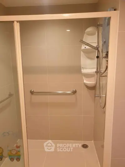 Modern bathroom with shower enclosure and safety grab bar