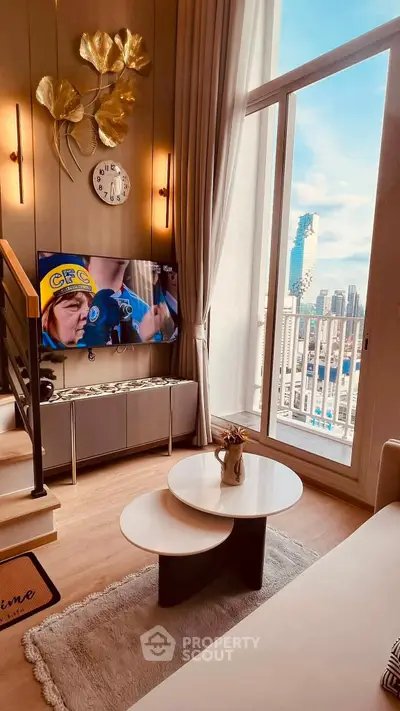 Luxurious living room with high ceilings and stunning city view from balcony.