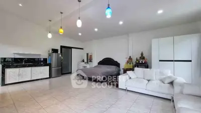 Spacious studio apartment with modern kitchen and cozy living area