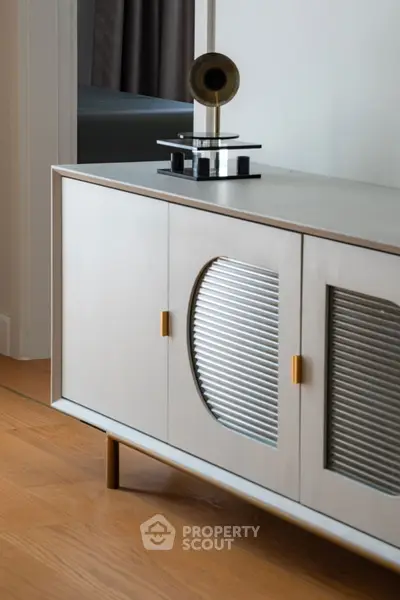 Stylish modern sideboard with decorative accents in a contemporary living space.