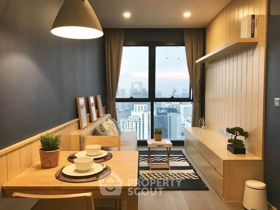 Modern living room with city view, stylish decor, and cozy dining area.