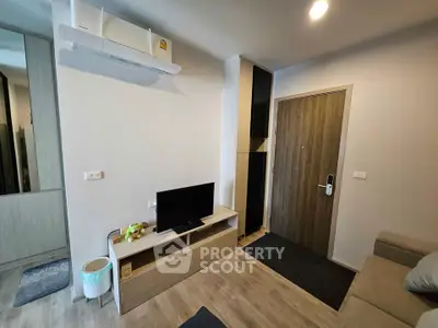 Modern living room with sleek furniture and air conditioning in a cozy apartment.