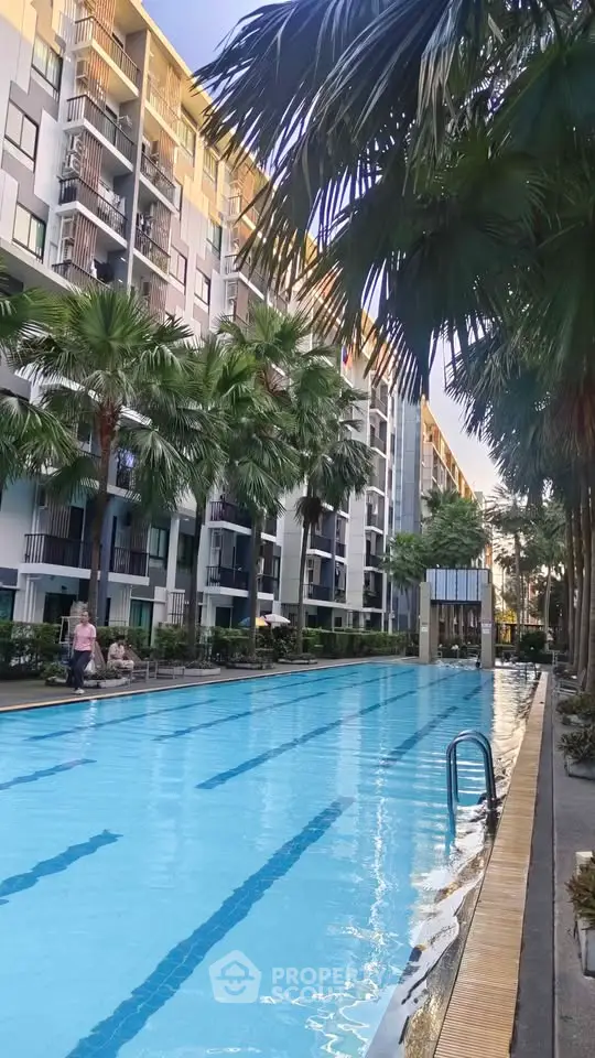 Luxurious condominium with stunning pool and lush palm trees
