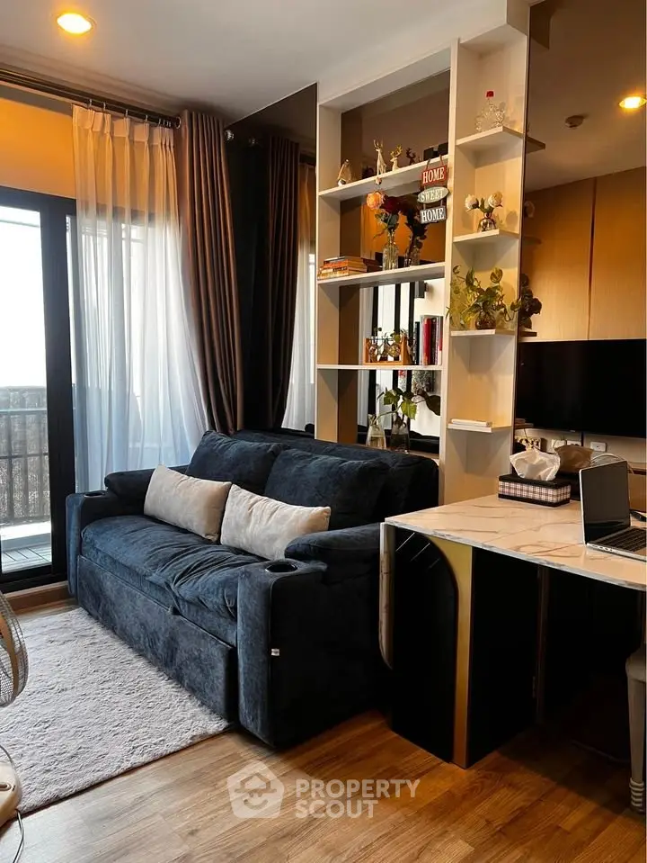 Modern living room with stylish decor and cozy sofa, featuring a sleek open layout and abundant natural light.