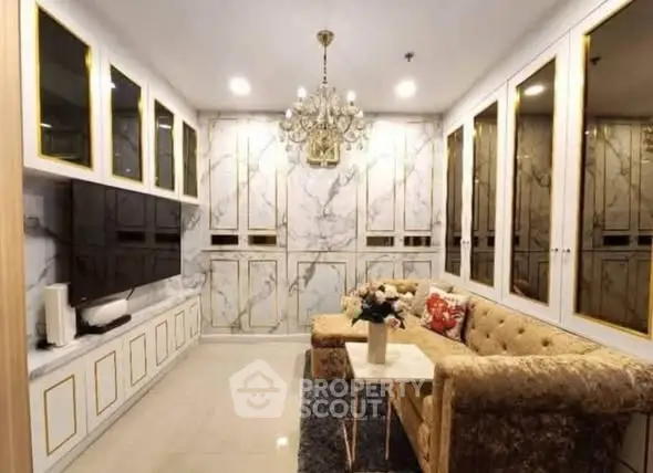 Luxurious living room with elegant chandelier and marble accents