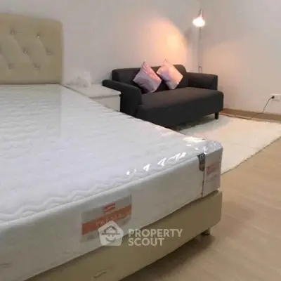 Modern bedroom with stylish furniture and cozy lighting, perfect for relaxation.