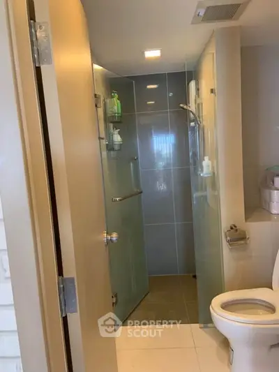 Modern bathroom with glass shower and sleek fixtures