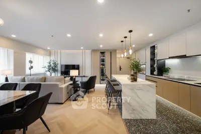 Luxurious open-plan living room with modern kitchen and elegant decor