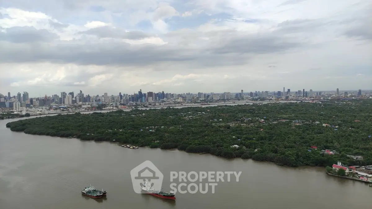 Stunning city skyline view over lush greenery and river, perfect for urban nature lovers.