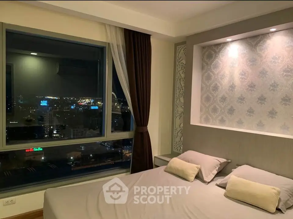 Luxurious bedroom with stunning night city view and elegant decor