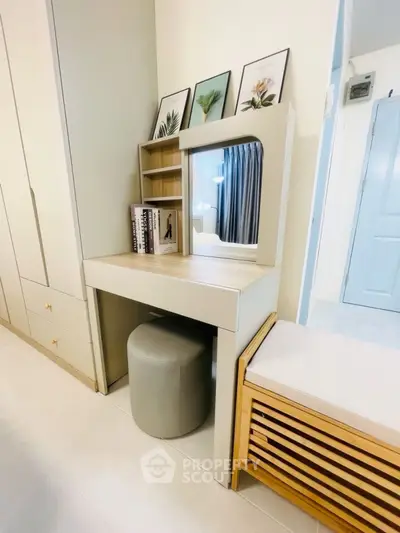 Stylish bedroom vanity with mirror and storage in modern apartment