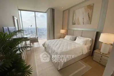 Luxurious bedroom with stunning city view and elegant decor