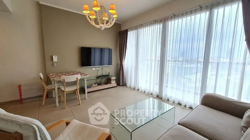 Spacious living room with large windows and modern decor