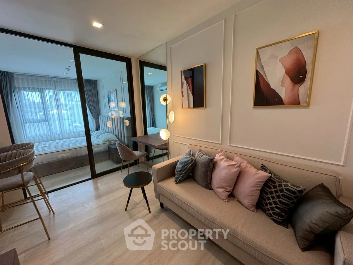 Modern living room with elegant decor and cozy seating in a stylish apartment