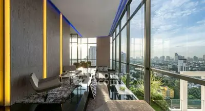 Luxurious high-rise living room with panoramic city views and modern decor.