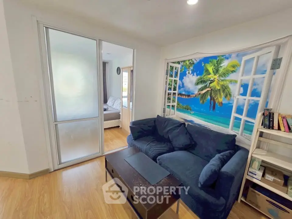 Cozy living room with tropical beach wall art and modern furnishings