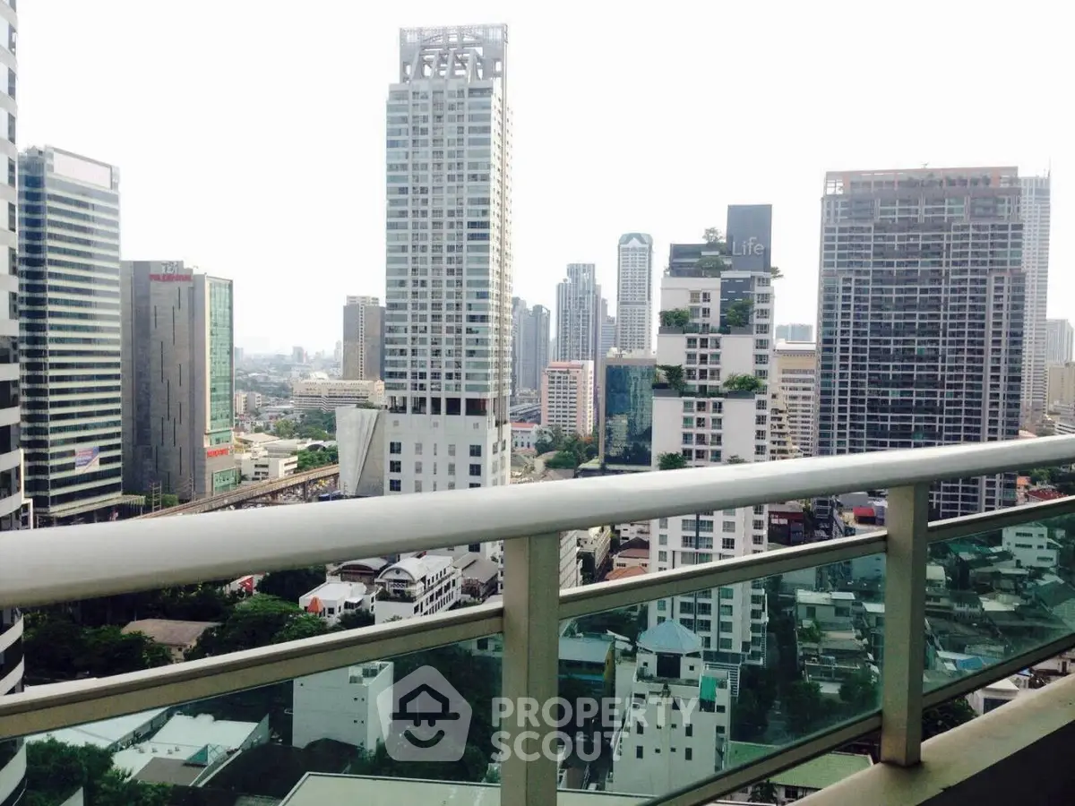 Stunning cityscape view from a high-rise balcony showcasing modern urban living.
