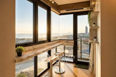 Stunning corner unit with panoramic sea view and modern interior design, perfect for enjoying sunsets.