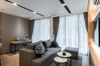 Modern living room with stylish furniture and large windows in a contemporary apartment.