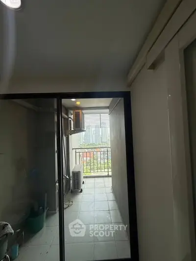 Compact balcony with city view, ideal for urban living.
