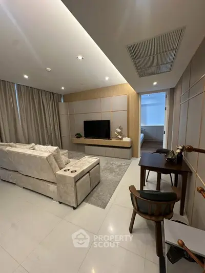 Modern living room with sleek design and cozy seating area