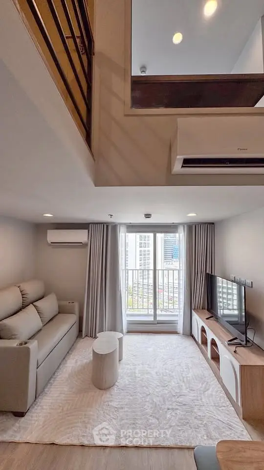 Modern living room with high ceiling and balcony view in stylish apartment