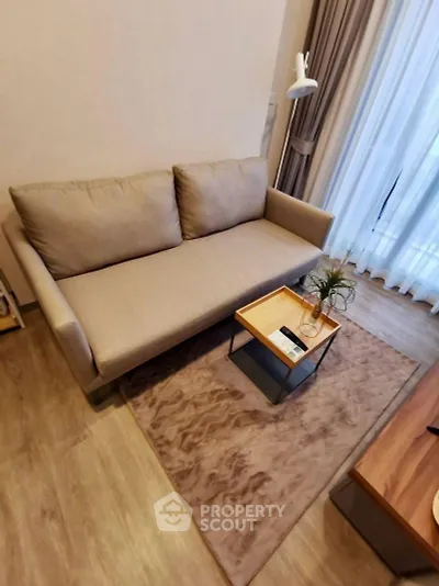Cozy living room with modern beige sofa and stylish decor